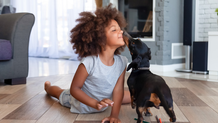 child playing with dog 